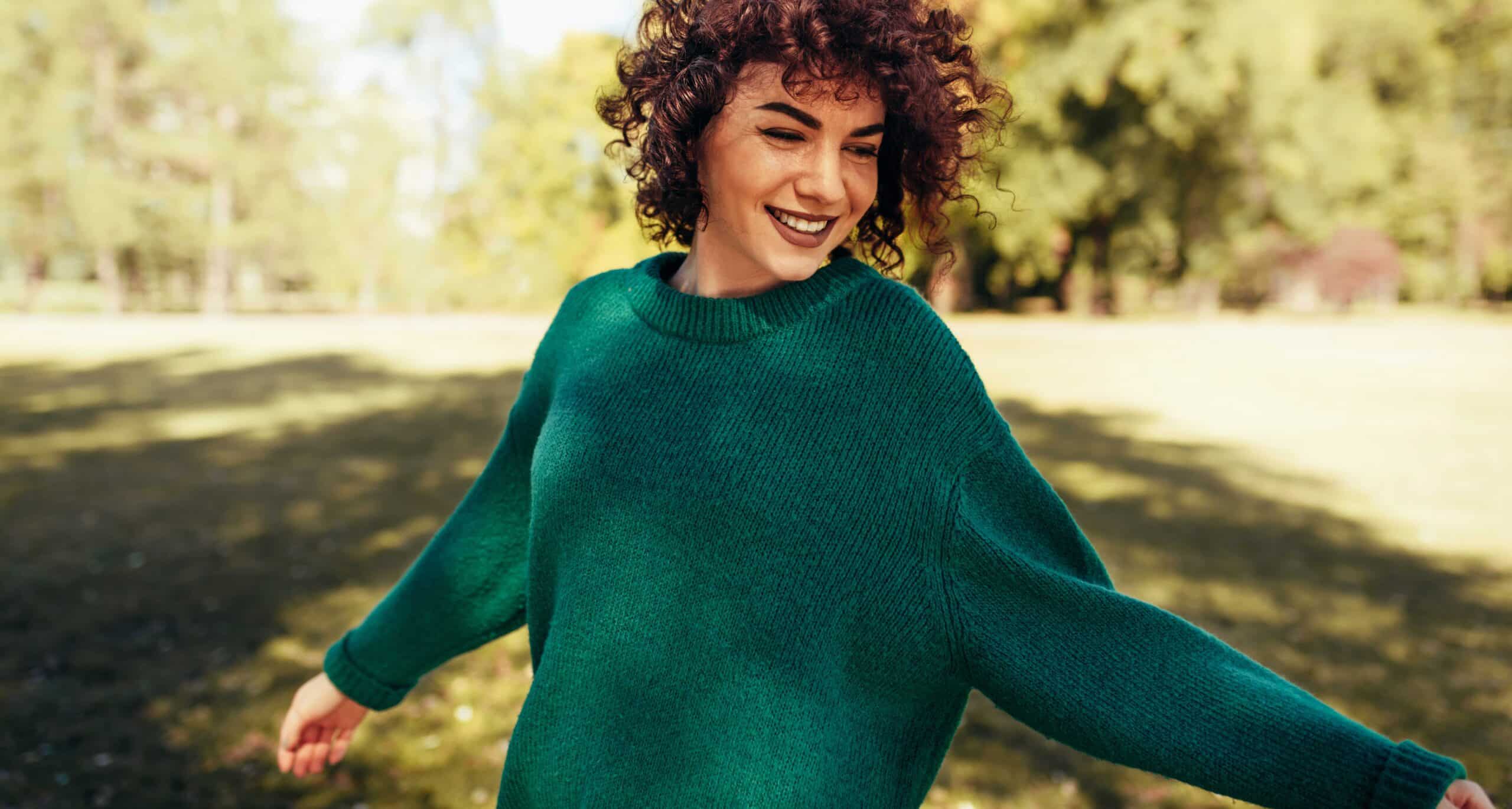 Free women twirling and smiling.