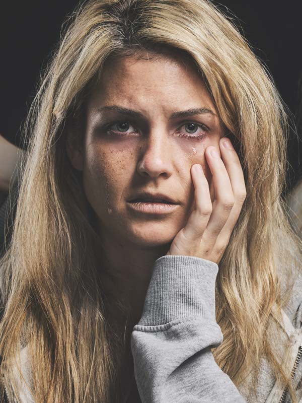 Sad woman in the depths of Psychosis spinning out of control.