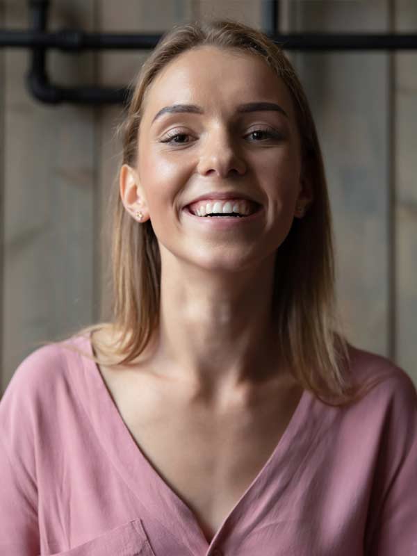 Young woman smiling having overcome her relationship difficulties.