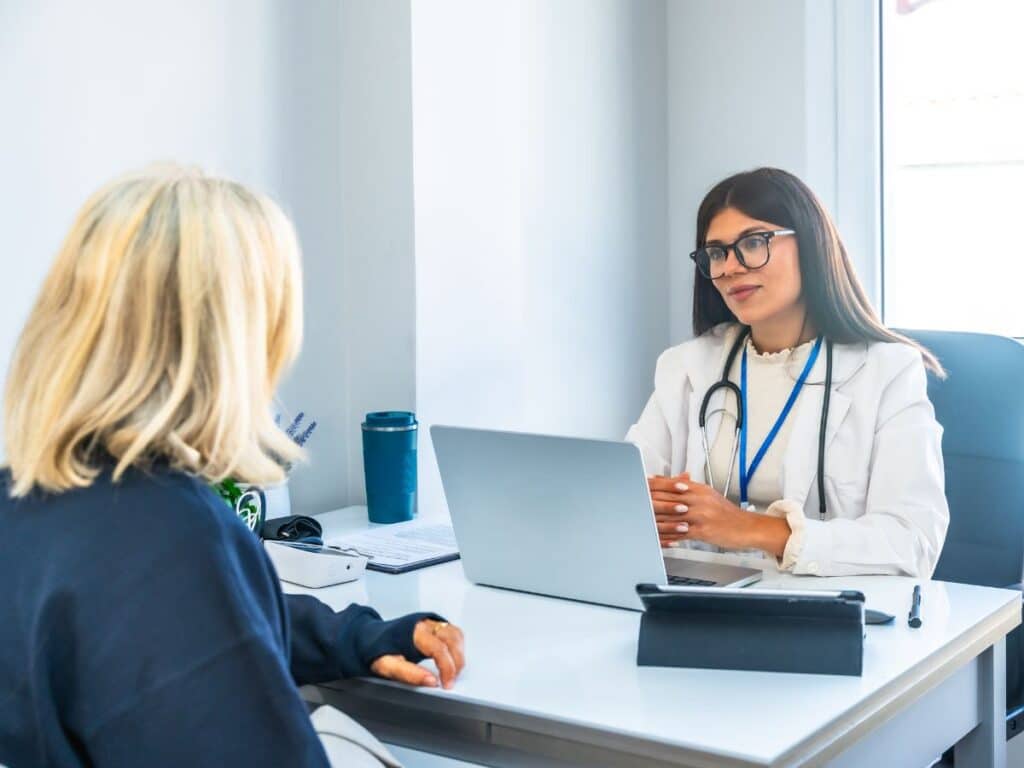 Psychiatrist explaining bipolar disorder medications options to patient