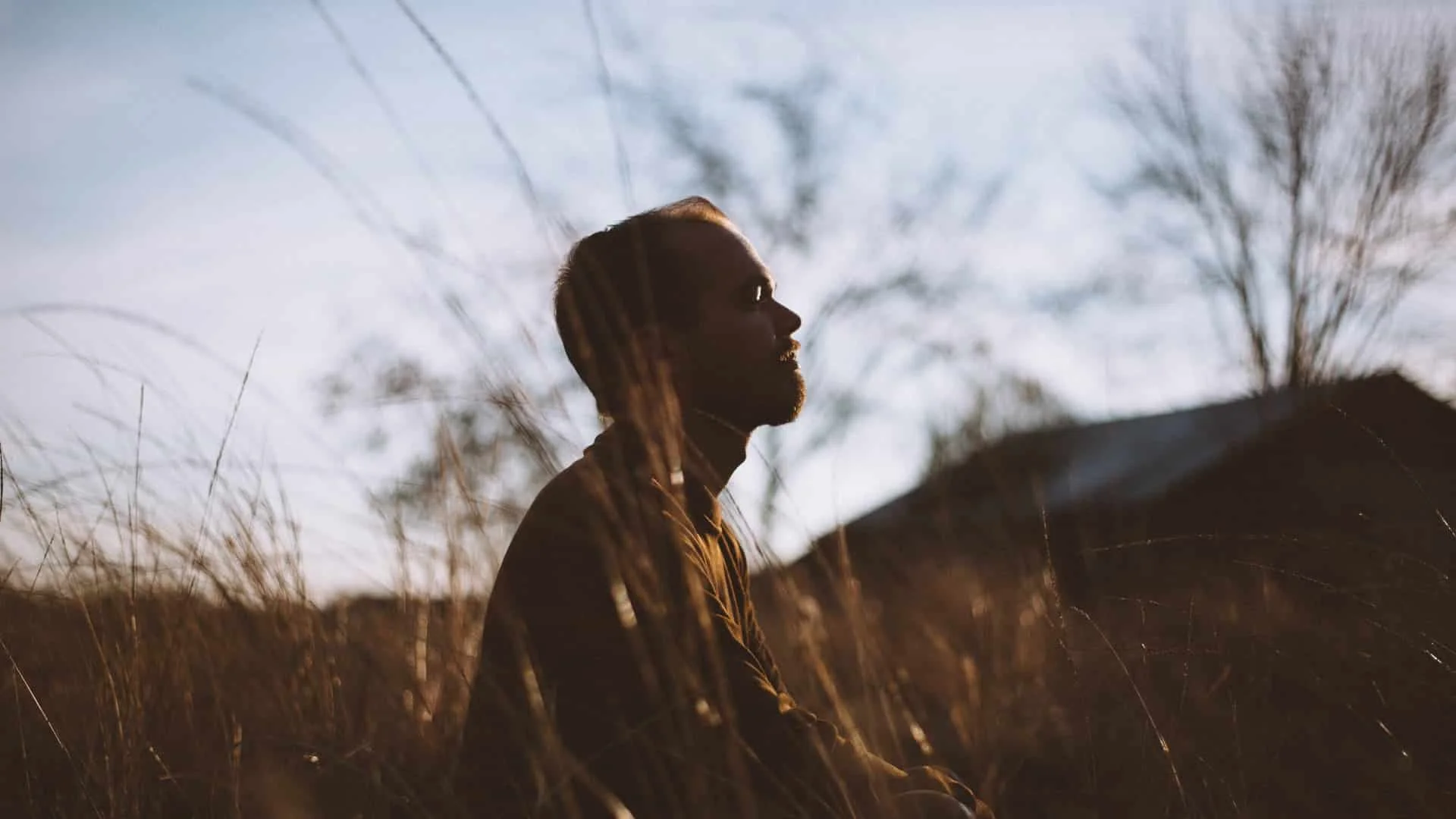 Man sitting with Trauma and dealing with it in a positive way.