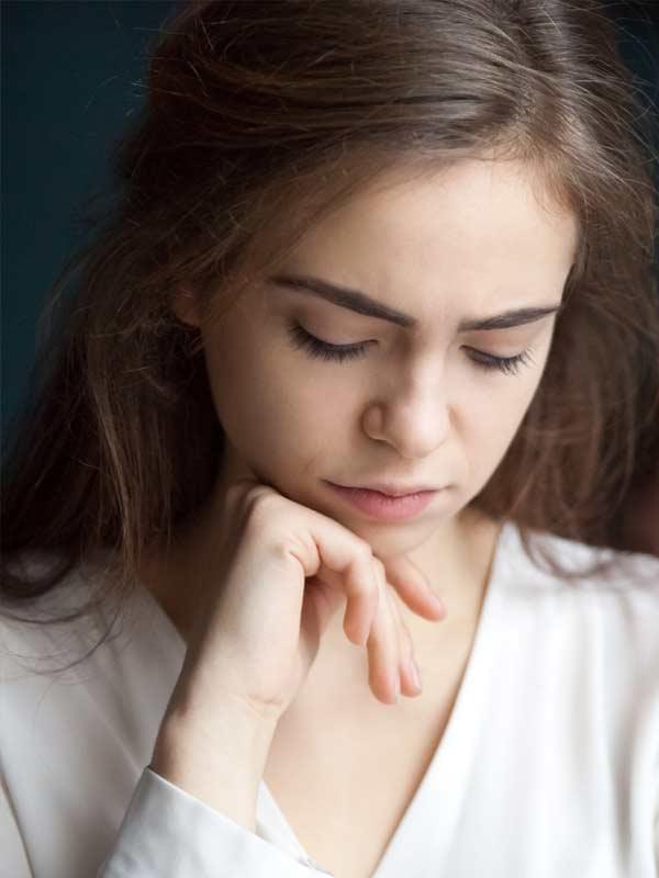 Female client in therapy session, seeking support for dependent personality disorder.