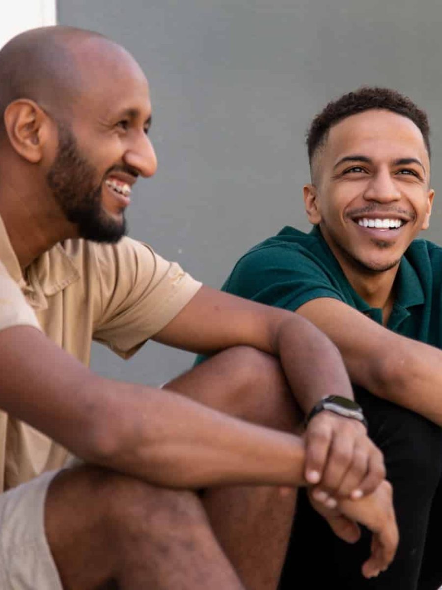 26 Two men smiling after dealing with Trauma in their lives.