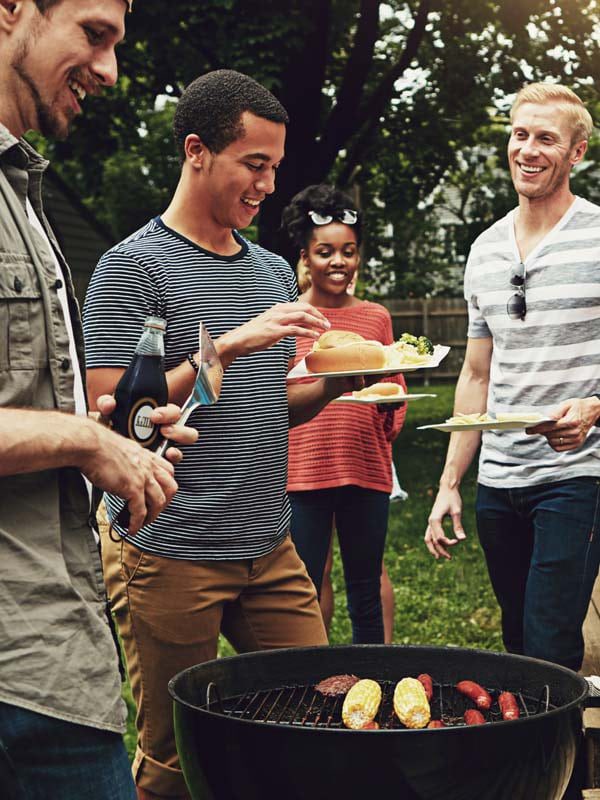 Social-Anxiety-Disorder-Mental-Health-Support-3 Friends gathered at a outdoor BBQ having fun and feeling more comfortable in social settings.