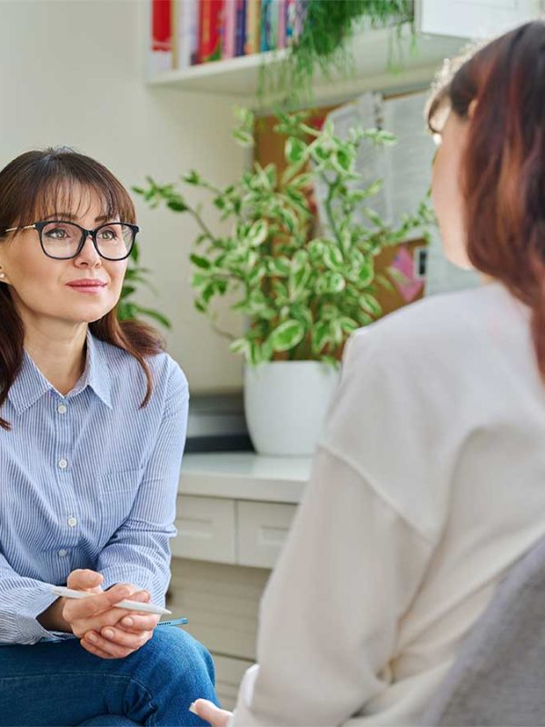 treating-mood-disorders-oc Female psychologist, working with young woman to treat mood disorder in Orange County CA office